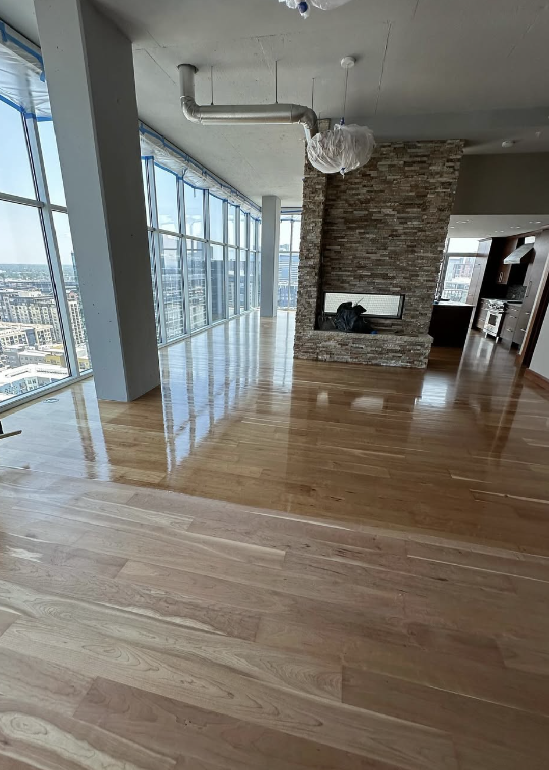 Freshly finished maple hardwood flooring in a Denver high-rise condo